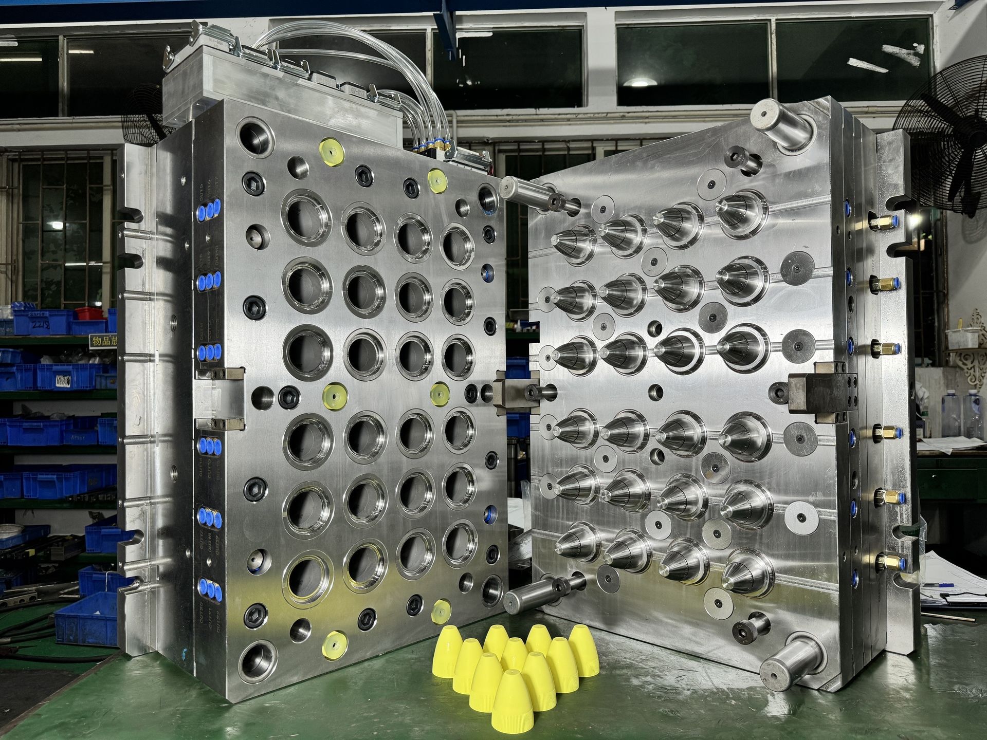 Multi-cavity bottle cap mold with molded parts shown together
